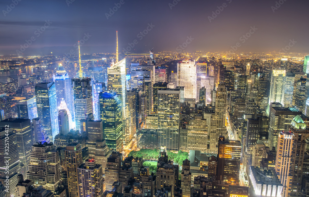 New York City, USA. Night aerial view of Midtown Manhattan skyscrapers from a high viewpoint