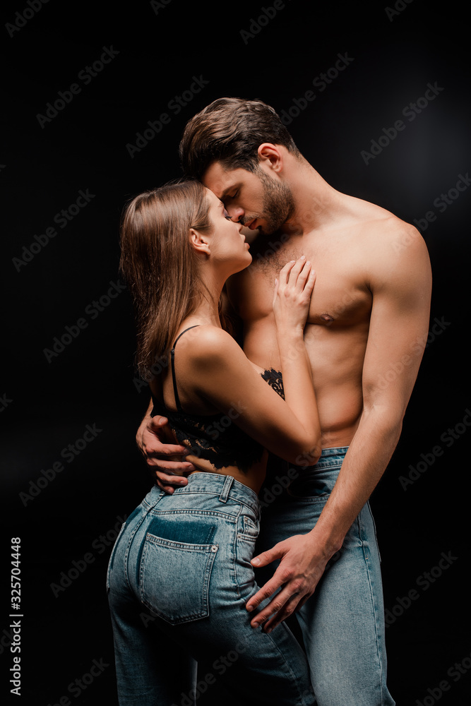 attractive woman standing with seductive man on black attractive woman standing with seductive man on black