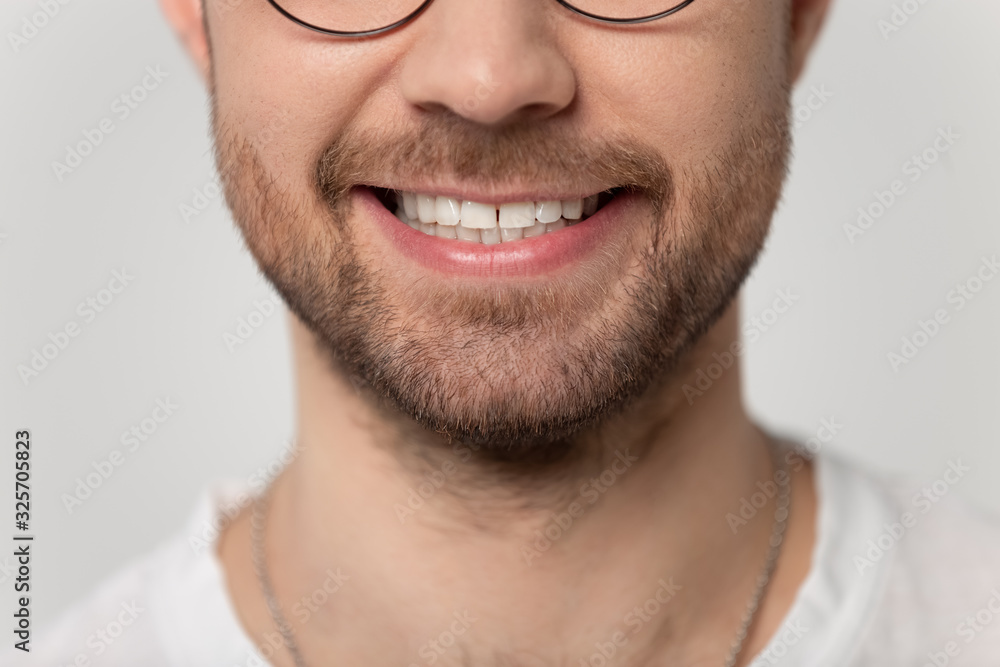 Close up cropped image wide toothy smiling young bearded man. Close up cropped image wide toothy smiling young bearded man.