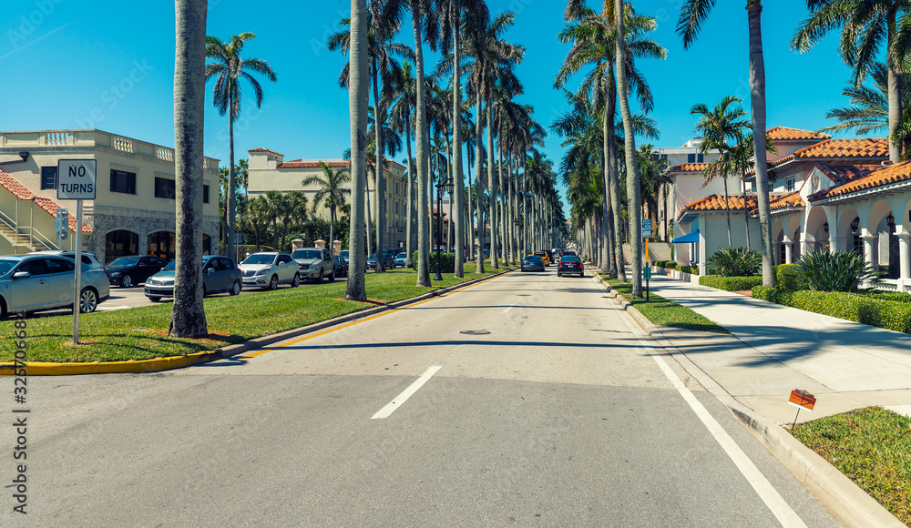PALM BEACH, FL - JAUNARY 8, 2016: City streets on a beautiful day. Palm Beach is a major Florida destination for tourists