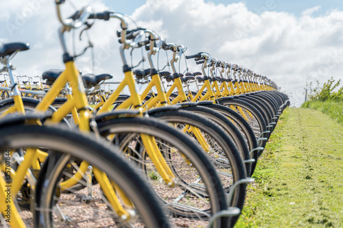 Photography Parked bikes on a huge bicycle parking lot.