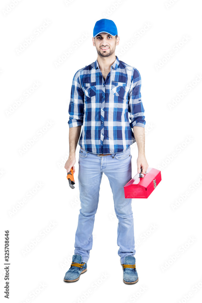 Young mechanic holding tool box and monkey wrench Young mechanic holding tool box and monkey wrench
