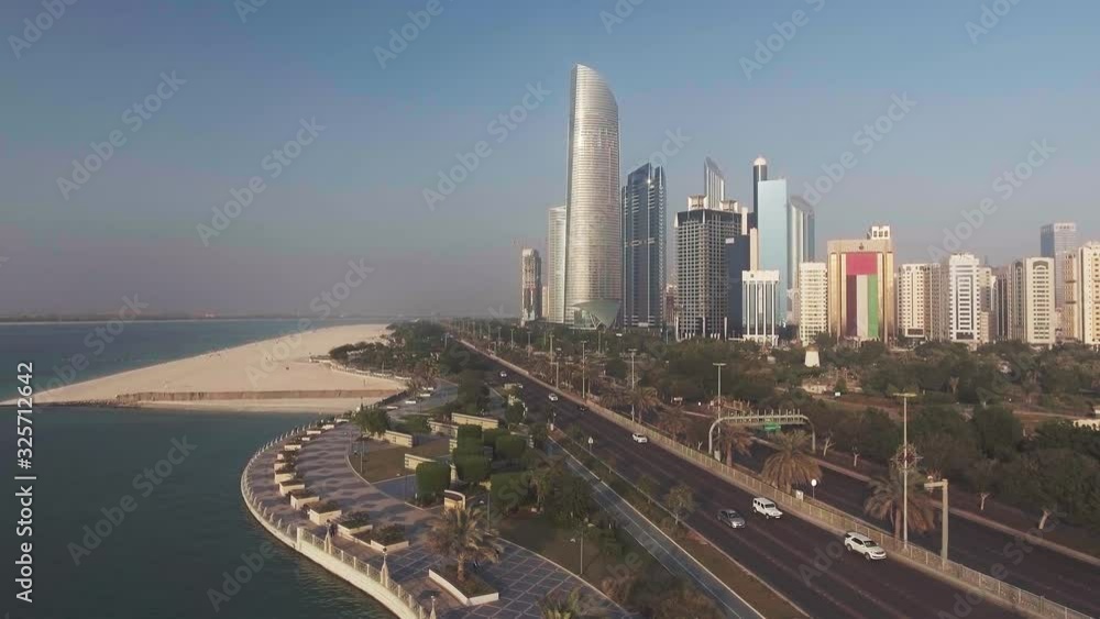 Abu Dhabi aerial skyline on a sunny day, going up in the sky with a drone Abu Dhabi aerial skyline on a sunny day, going up in the sky with a drone