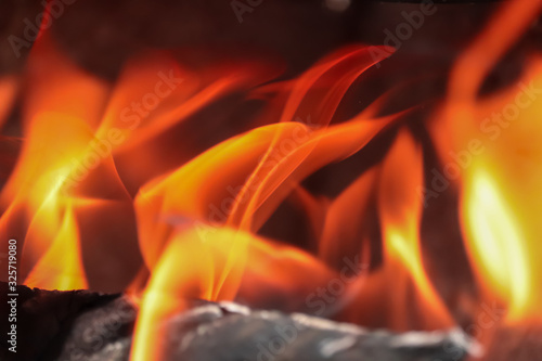 Closeup photo of warm fireplace,fire wooden