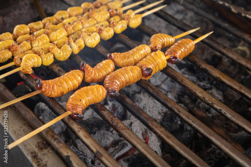 Edible palm weevil larvae (Rhynchophorus phoenicis) at traditional food market in Puerto Francisco de Orellana. Ecuador. Amazon. photo