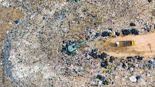 Ecosystem and healthy environment concepts and background, Garbage pile in trash dump or landfill, Aerial view garbage trucks unload garbage to a landfill, global warming.