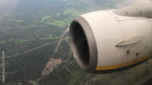 Big Turbofan Engine Flying Close Up. Airplane Passenger View.