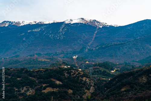 Lake Garda Italy in cold foggy day in winter holidays with city historical view  lake and mountain and cable car 