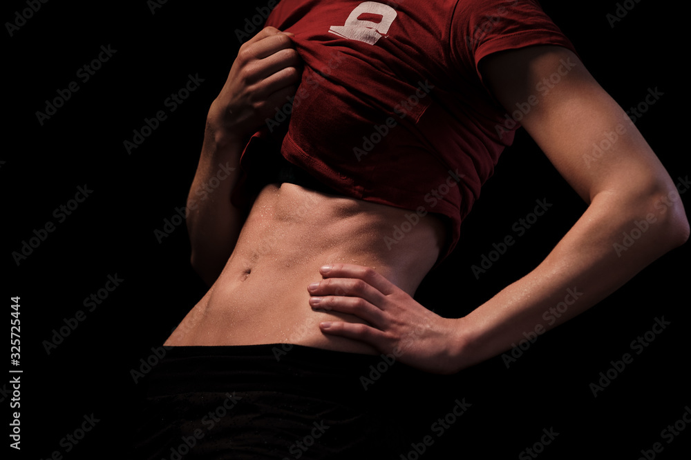 Naklejka premium Trained belly of a beautiful woman