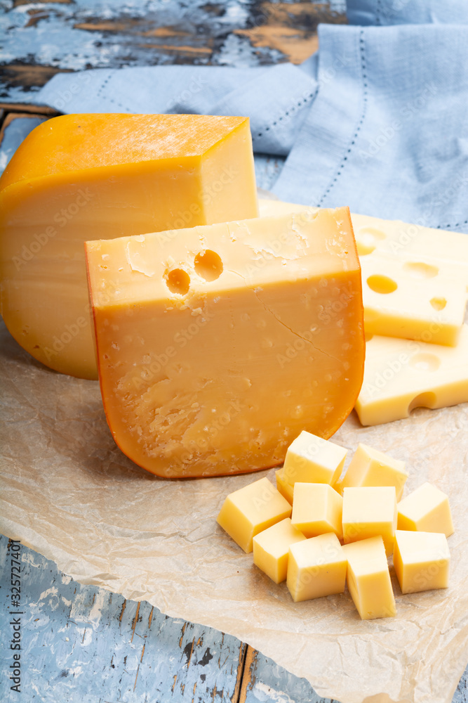 Famous hard cheeses, Dutch Gouda and French Emmentaler in pieces and