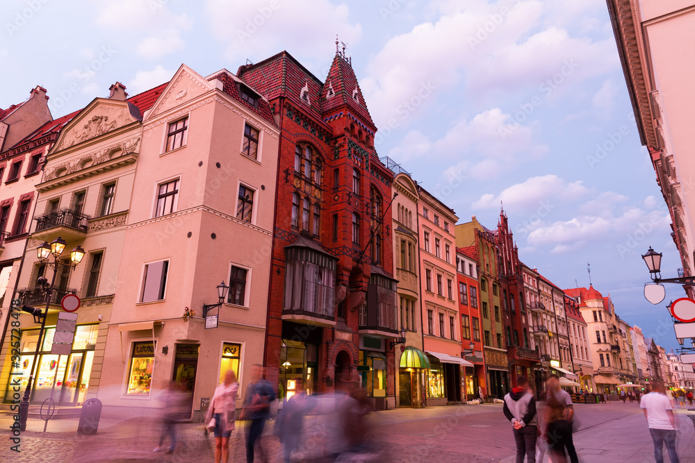 Night view of Torun streets and building illuminated at dusk