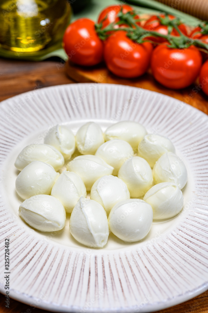 Cheese collection, white mini mozzarella cheese balls for salad or for appetizer snacks Cheese collection, white mini mozzarella cheese balls for salad or for appetizer snacks