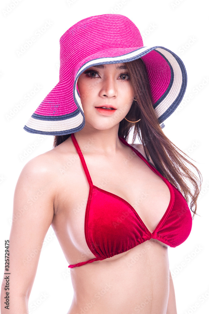 Cute asian woman in red bikini, summer hat and jeans isolated in white background. Medium shot. Sexy summer concept. Cute asian woman in red bikini, summer hat and jeans isolated in white background. Medium shot. Sexy summer concept.