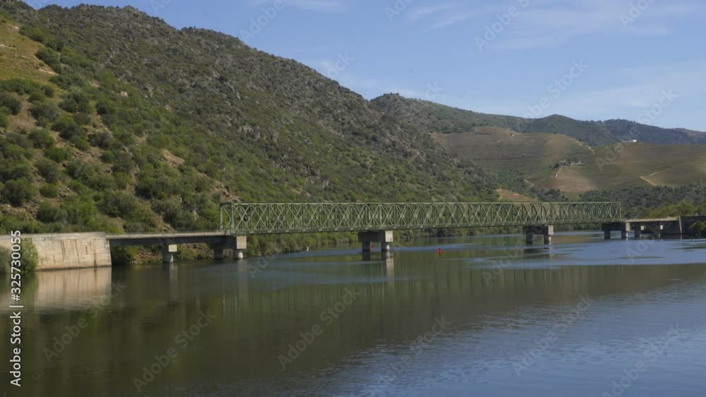 Train on Railway bridge in Douro region in Ferradosa, Portugal Train on Railway bridge in Douro region in Ferradosa, Portugal
