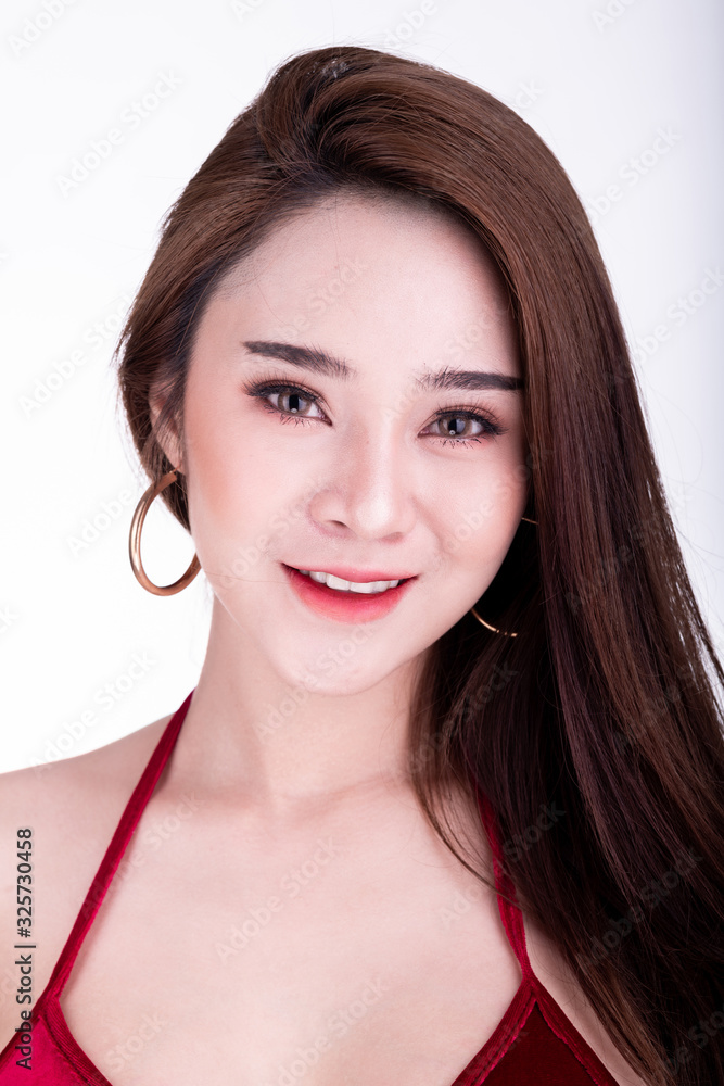 Portrait of beautiful thai woman isolated in white background. Happy smile.