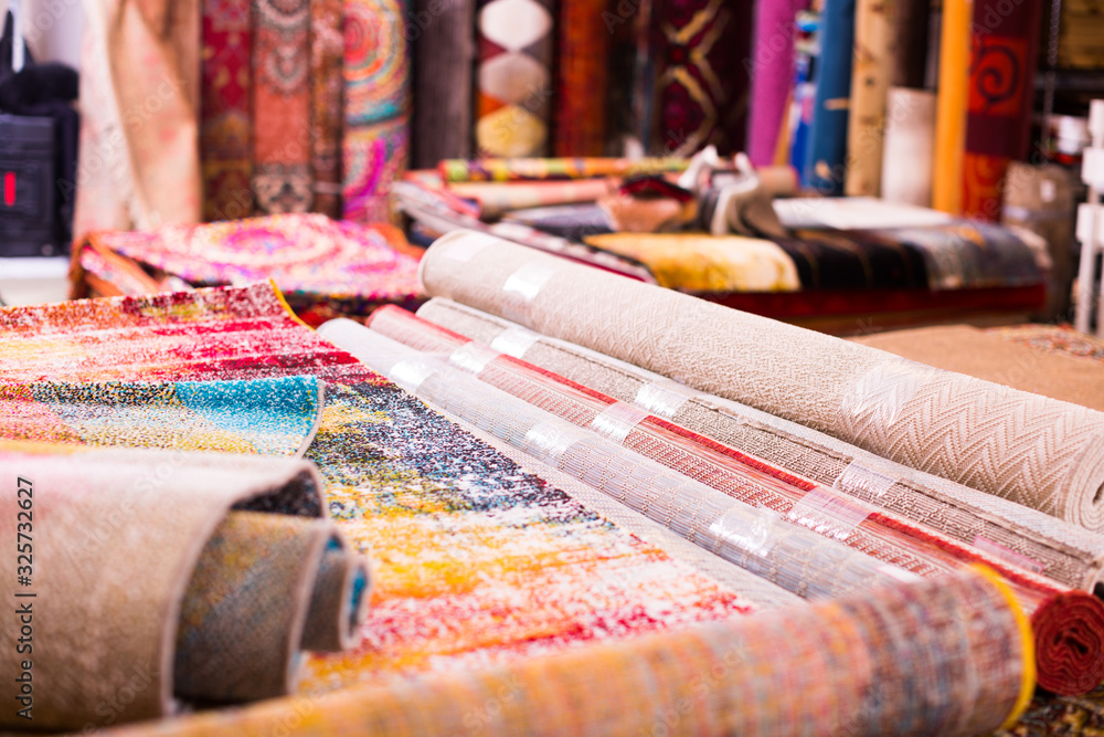 Fototapeta premium Image of colorful wool carpets for sale at showroom