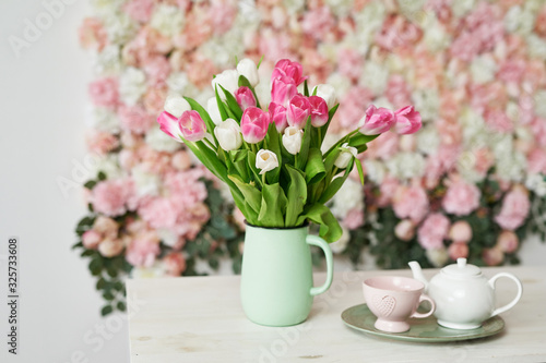 Fototapeta Naklejka Na Ścianę i Meble -  Tulips on floral background on flowers festive background, pastel and soft bouquet floral card. Spring Greeting Card Template. Copy Space. Wedding scene. Mothers Day,female card