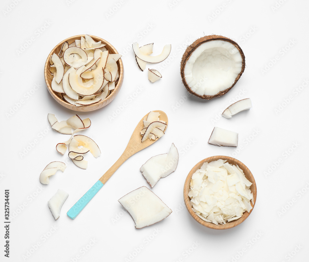 Composition with tasty coconut chips on white background, top view Composition with tasty coconut chips on white background, top view