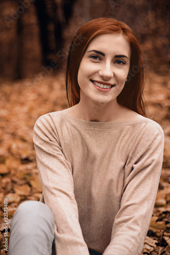 a happy girl relaxed in forest Automn