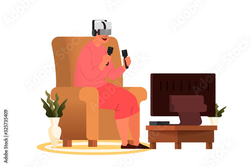 Old woman playing video games. Senior playing video games