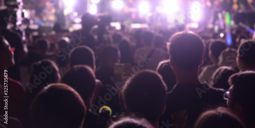 Abstract blurred background of Music concert any people. Crowd attending a concert.