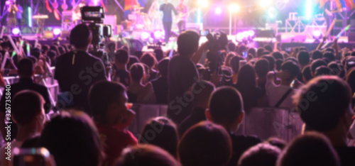 Abstract blurred background of Music concert any people. Crowd attending a concert.