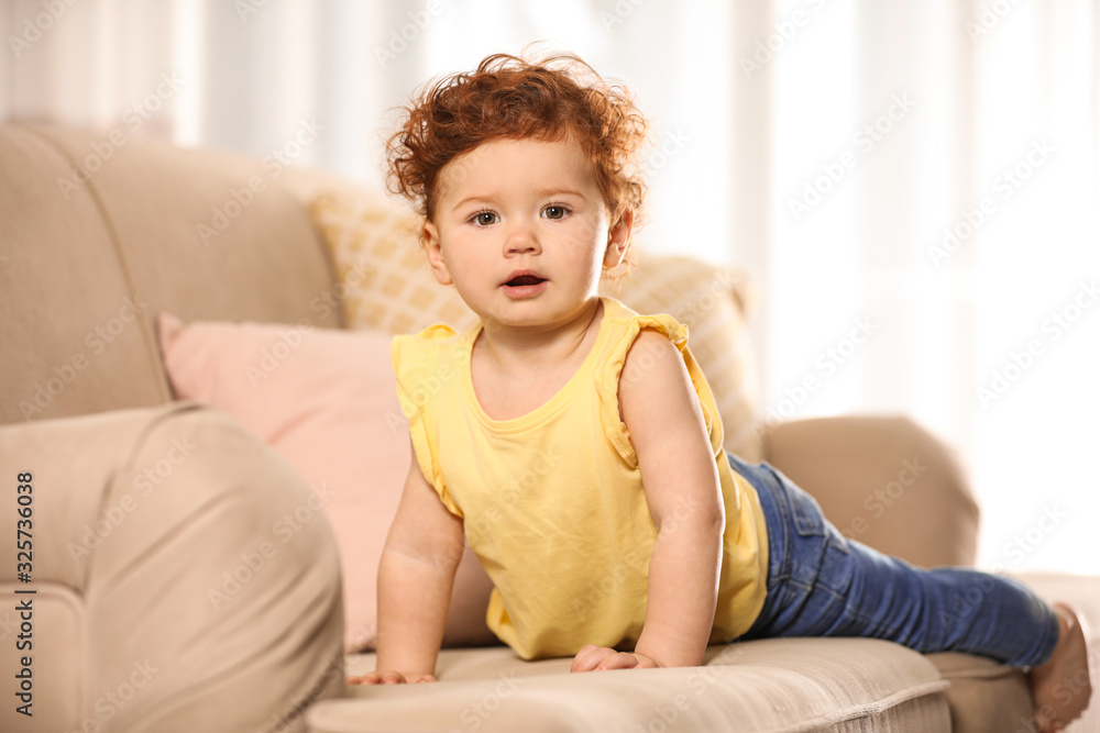Portrait of cute little child on sofa at home Portrait of cute little child on sofa at home