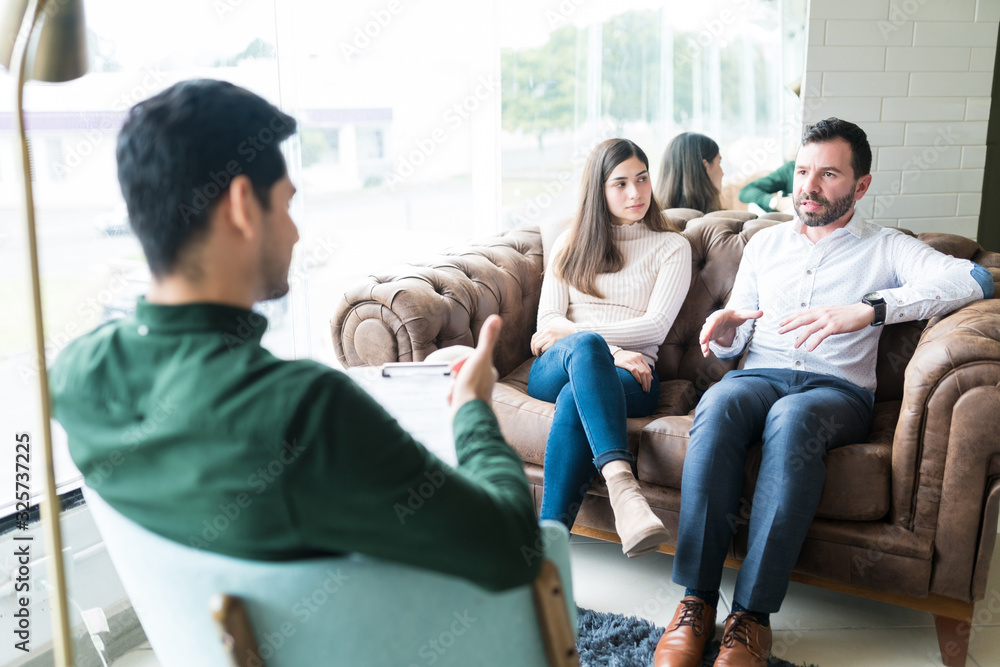 Unhappy Couple At Therapy Session With Psychologist Unhappy Couple At Therapy Session With Psychologist