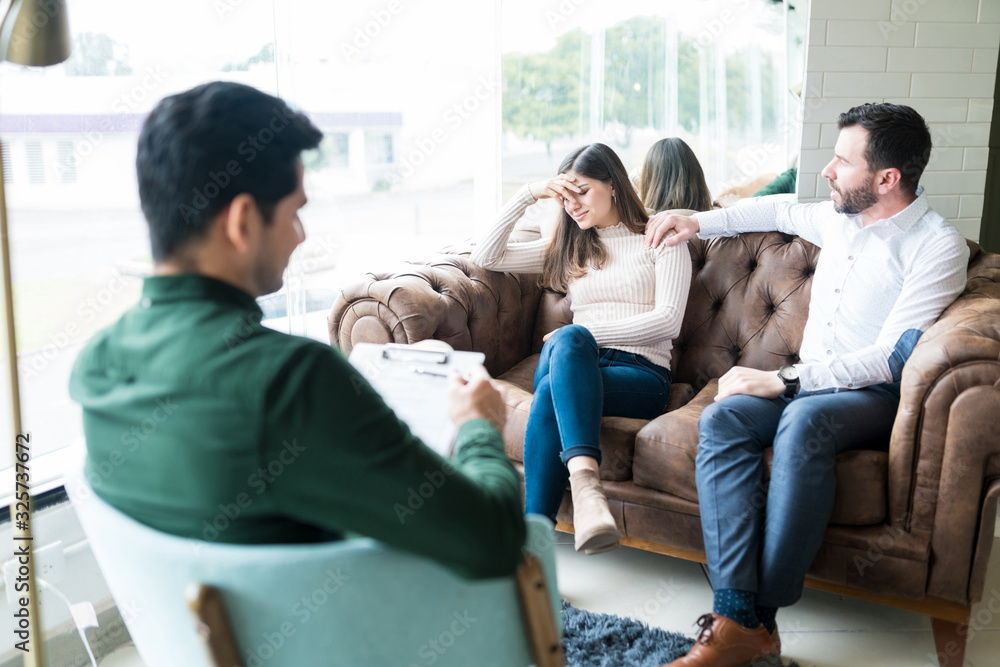 Husband And Wife Sharing Their Problems With Counselor Husband And Wife Sharing Their Problems With Counselor