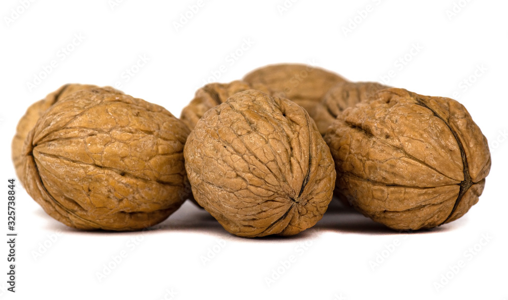 Delicious whole walnuts isolated on a white background Delicious whole walnuts isolated on a white background
