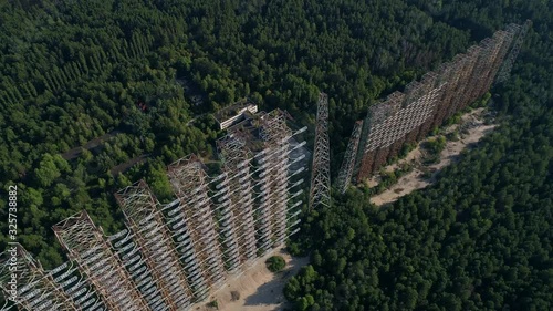 Aerial view of the DUGA radar station near the city of Chernobyl-2 among the forest. Exclusion Zone. 4K drone footage. photo