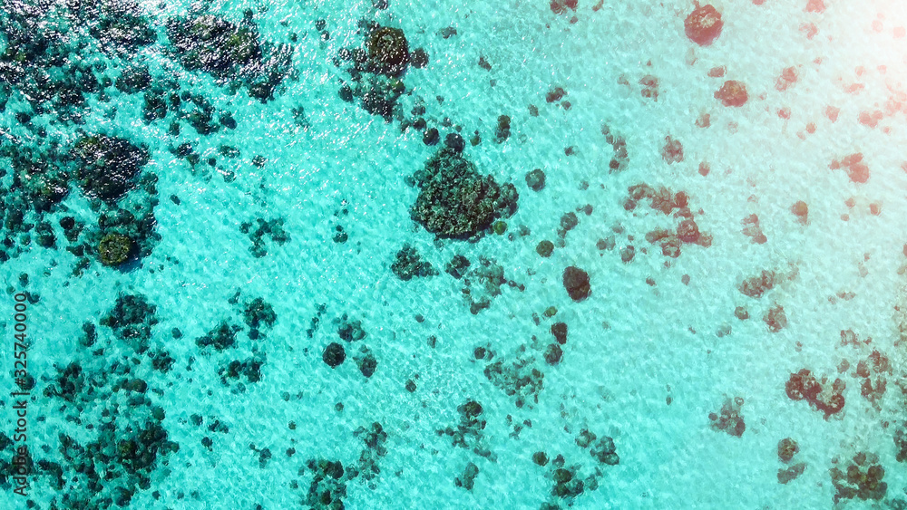 Overhead aerial view of beautiful ocean with coral reef from drone Overhead aerial view of beautiful ocean with coral reef from drone