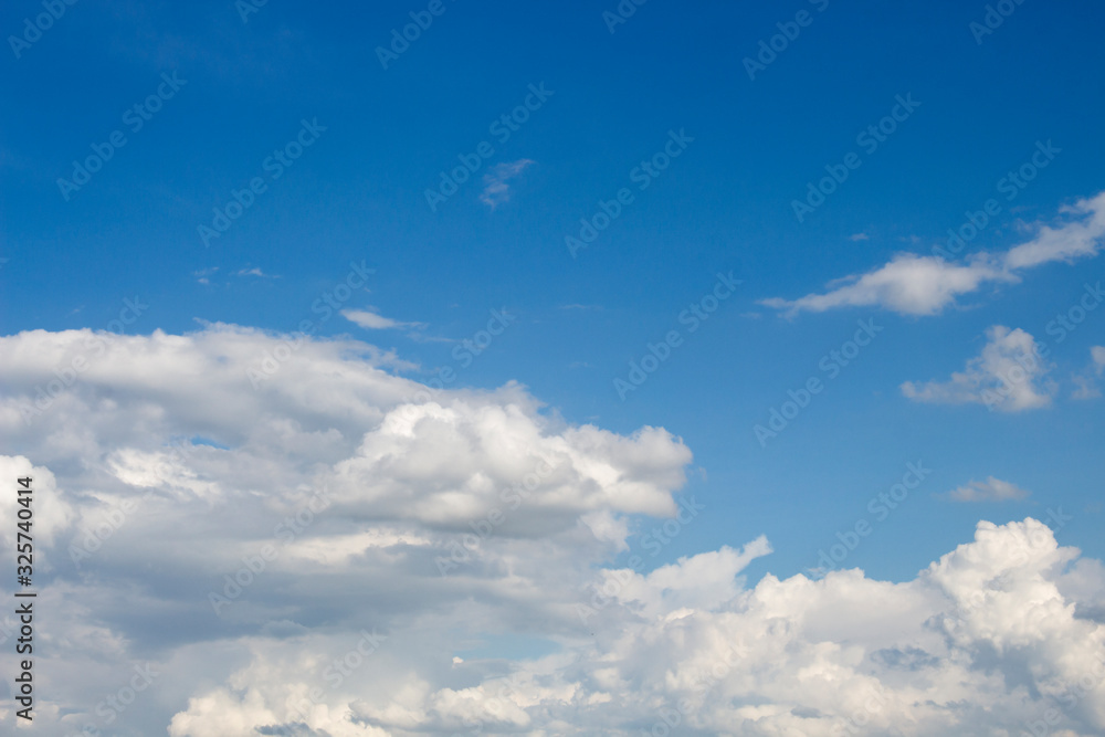 Bright blue sky with white clouds for background or wallpapers