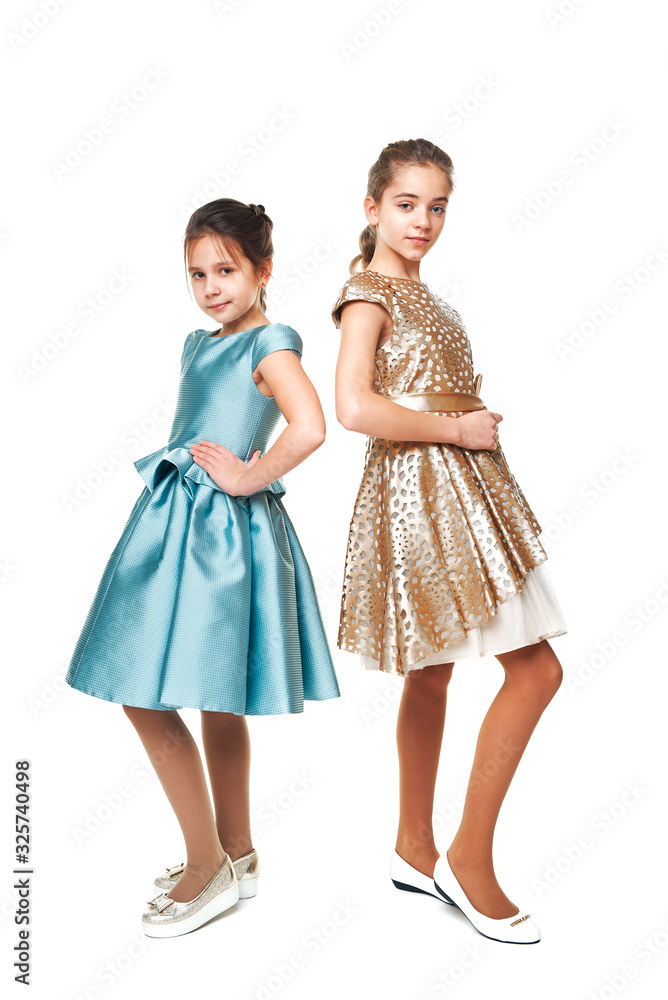 two girlfriends. portrait of girls in the studio. fashion shooting of children. two girlfriends. portrait of girls in the studio. fashion shooting of children.