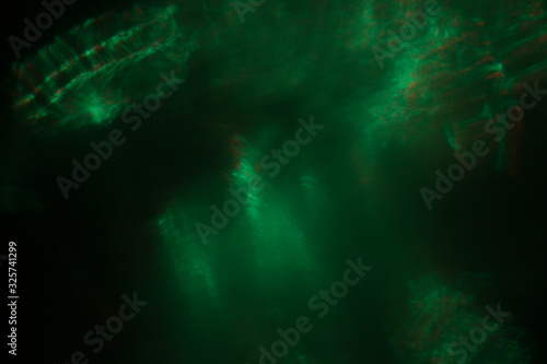 Blurred lens flare. Defocused colorful lights. Shiny glowing spots, abstract background and texture