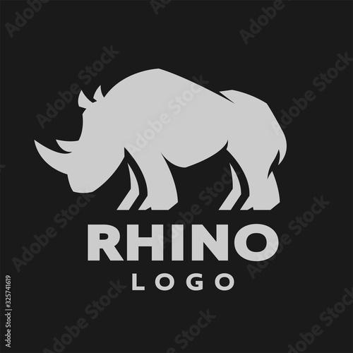 African rhino silhouette. Logo, symbol on a dark background. Vector illustration.