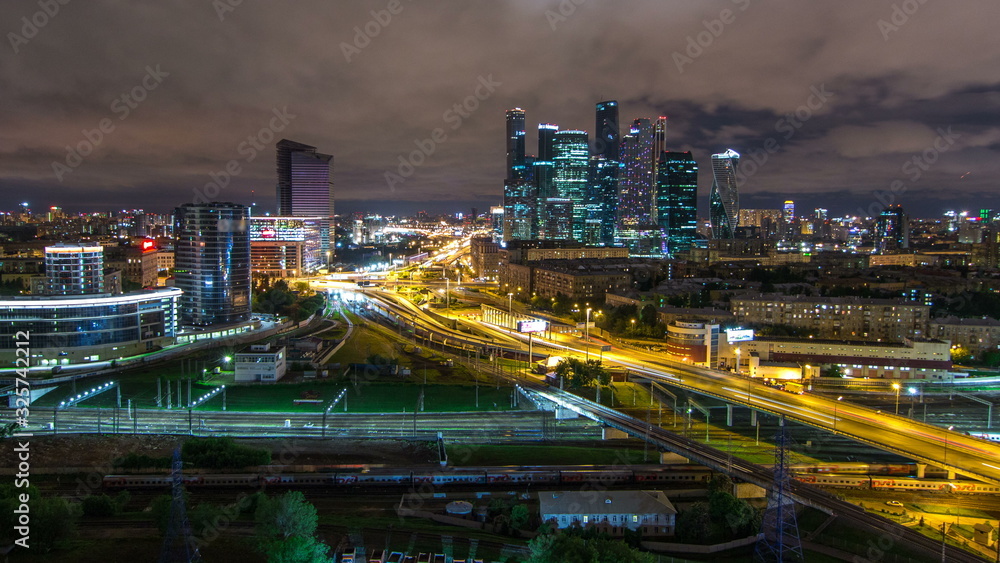 Night view of the city traffic timelapse and Building of Moscow International Business Center Moscow-City