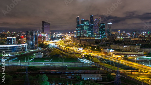 Night view of the city traffic timelapse and Building of Moscow International Business Center Moscow-City