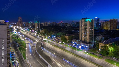 Traffic on avenue Marshal Zhukov timelapse in Moscow at night photo