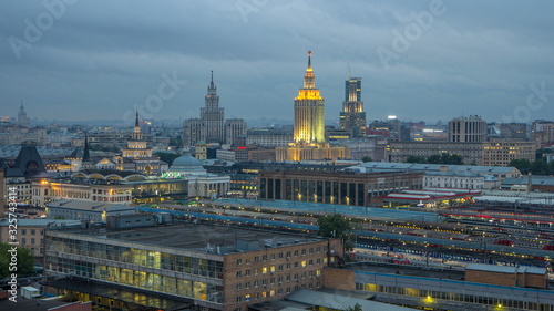Evening top view of three railway stations day to night timelapse at the Komsomolskaya square in Moscow, Russia photo