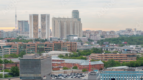 Moscow cityscape from rooftop timelapse. Residential buildings and Ostankinskaya tv tower. Aerial view from the roof photo