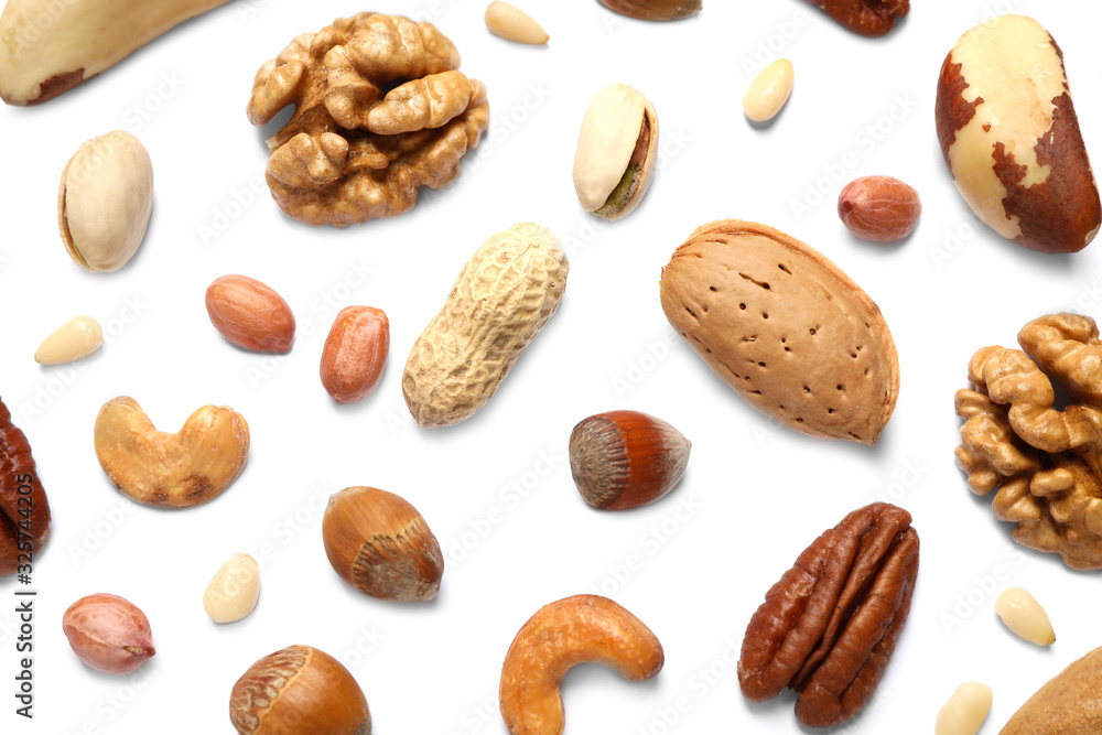 Different delicious nuts on white background, flat lay Different delicious nuts on white background, flat lay