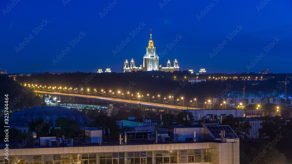 Night cityscape view of Moscow timelapse. View from rooftop to the main building of Moscow State University at night