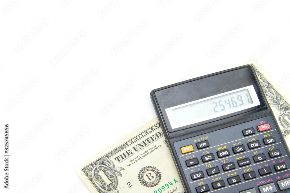 A black engineering calculator (not completely, but part) with gray buttons and a banknote of one American dollar under it. White isolated background. Accounting for finance and budget. A black engineering calculator (not completely, but part) with gray buttons and a banknote of one American dollar under it. White isolated background. Accounting for finance and budget.