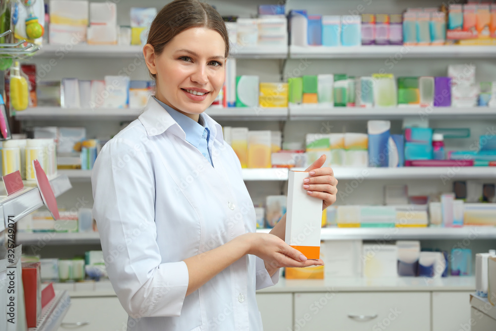 Professional pharmacist with medicine in modern drugstore Professional pharmacist with medicine in modern drugstore