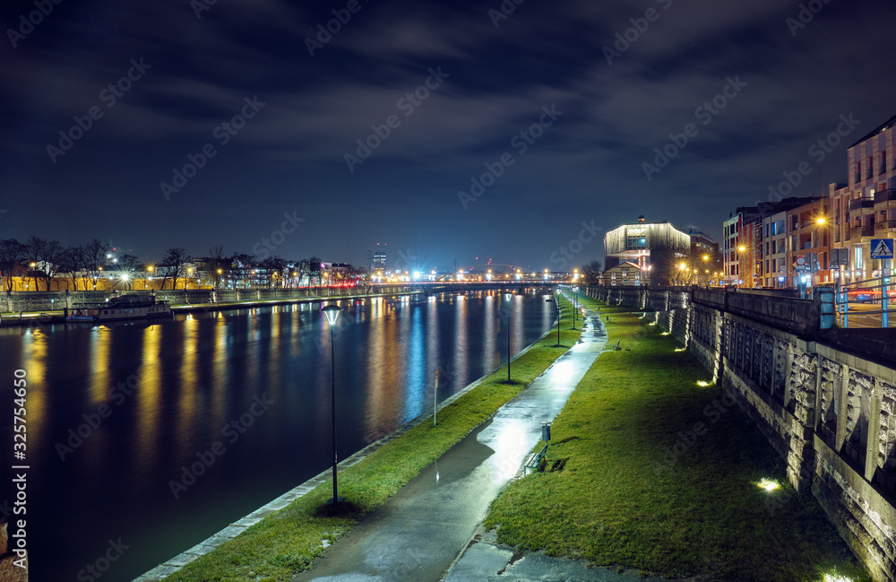 Vistula River in Krakow at night.