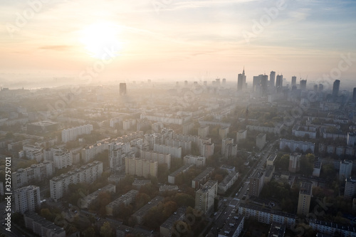 Aerial view of skyscrapers in the center of the Warsaw at sunrise.