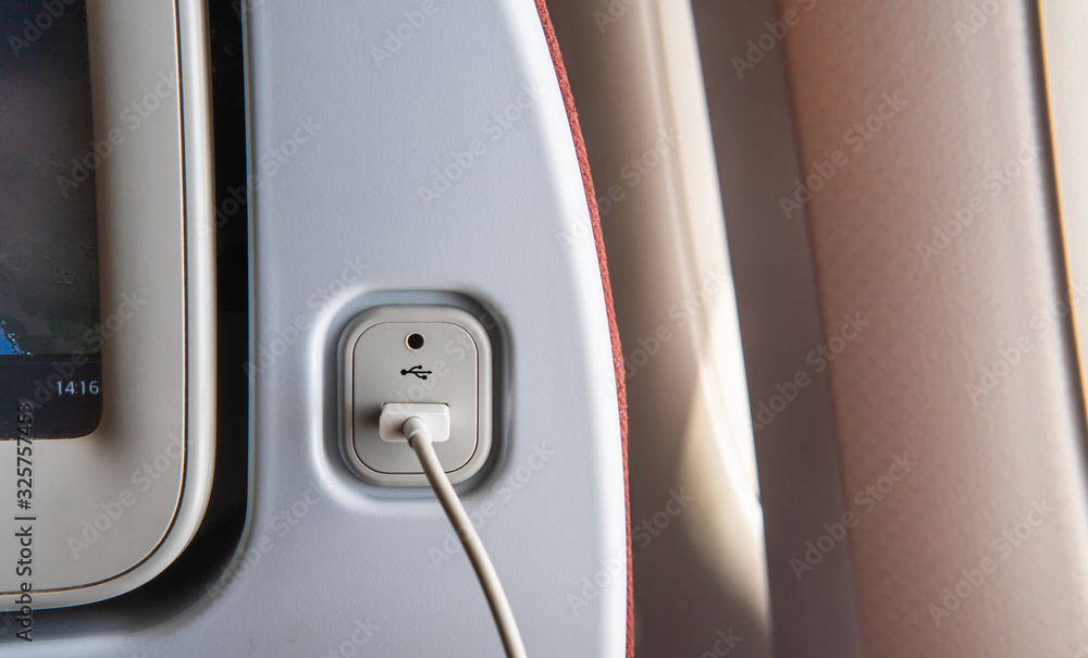 USB port at the seat of airplane for charging the electronics devices