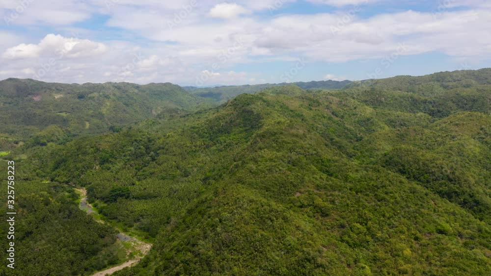 Mountain landscape with rainforest, aerial view. Hills covered with jungle. Summer and travel vacation concept. Mountains on Leyte Island, Philippines. Mountain landscape with rainforest, aerial view. Hills covered with jungle. Summer and travel vacation concept. Mountains on Leyte Island, Philippines.