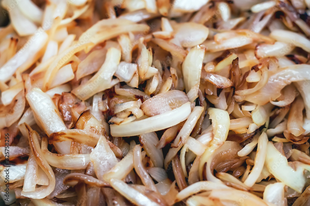 Close up abstract photo of fried onions. Cooking food.